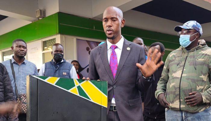 Nairobi County Chief Officer for Environment Geoffrey Mosiria inspecting damaged dustbins.
